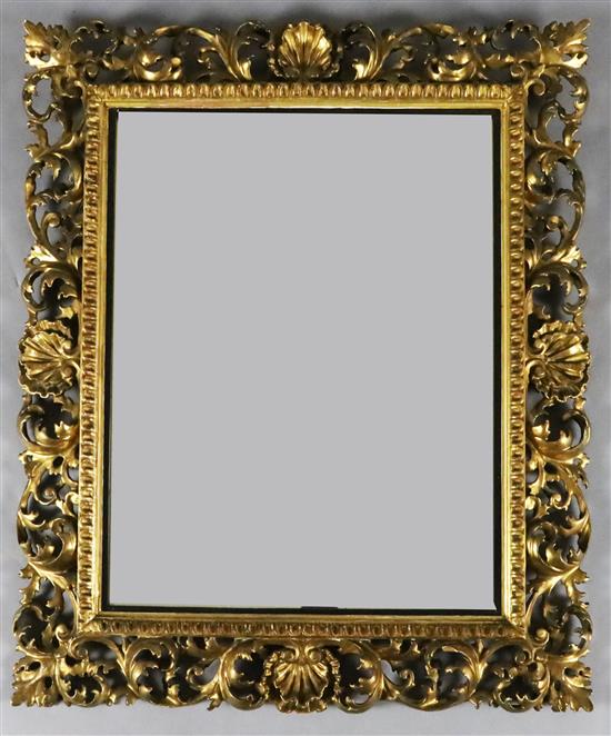 A 19th century Florentine carved and pierced giltwood wall mirror, W.2ft 3in. H.2ft 7in.